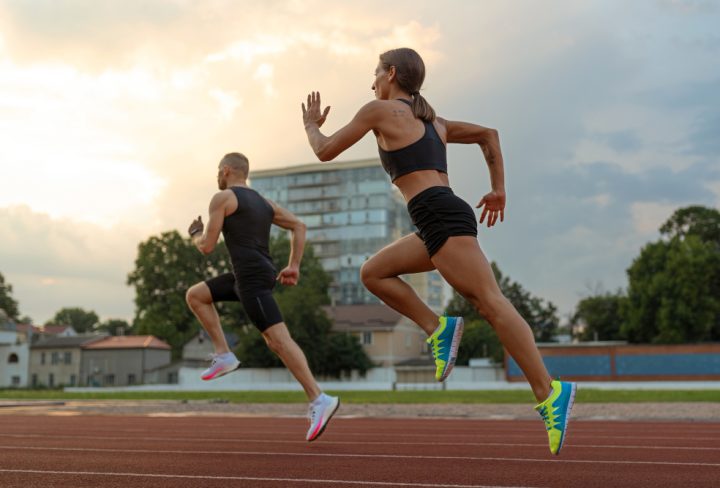 man-woman-running-track-side-view